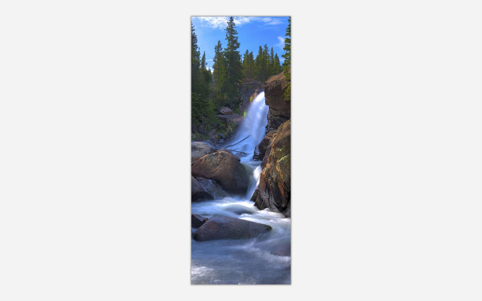 Alberta-Fall-2 A vertical panoramic photograph of a beautiful cascading waterfall surrounded by forest and rocks, ideal for wall decor.