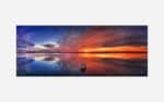 A panoramic painting of a tranquil lake sunset with vibrant sky colors reflected in the water and a lone boat.