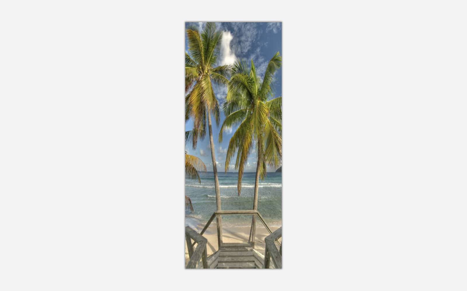 Boardwalk to the Beach A vertical panoramic art print of a wooden staircase leading down to a serene beach flanked by tall palm trees with a beautiful blue ocean in the background.