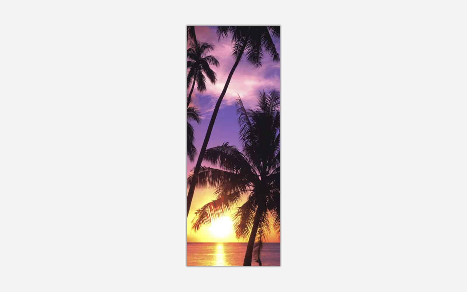 Day End A tall vertical canvas print of a serene tropical sunset with palm tree silhouettes against a purple sky over the ocean.