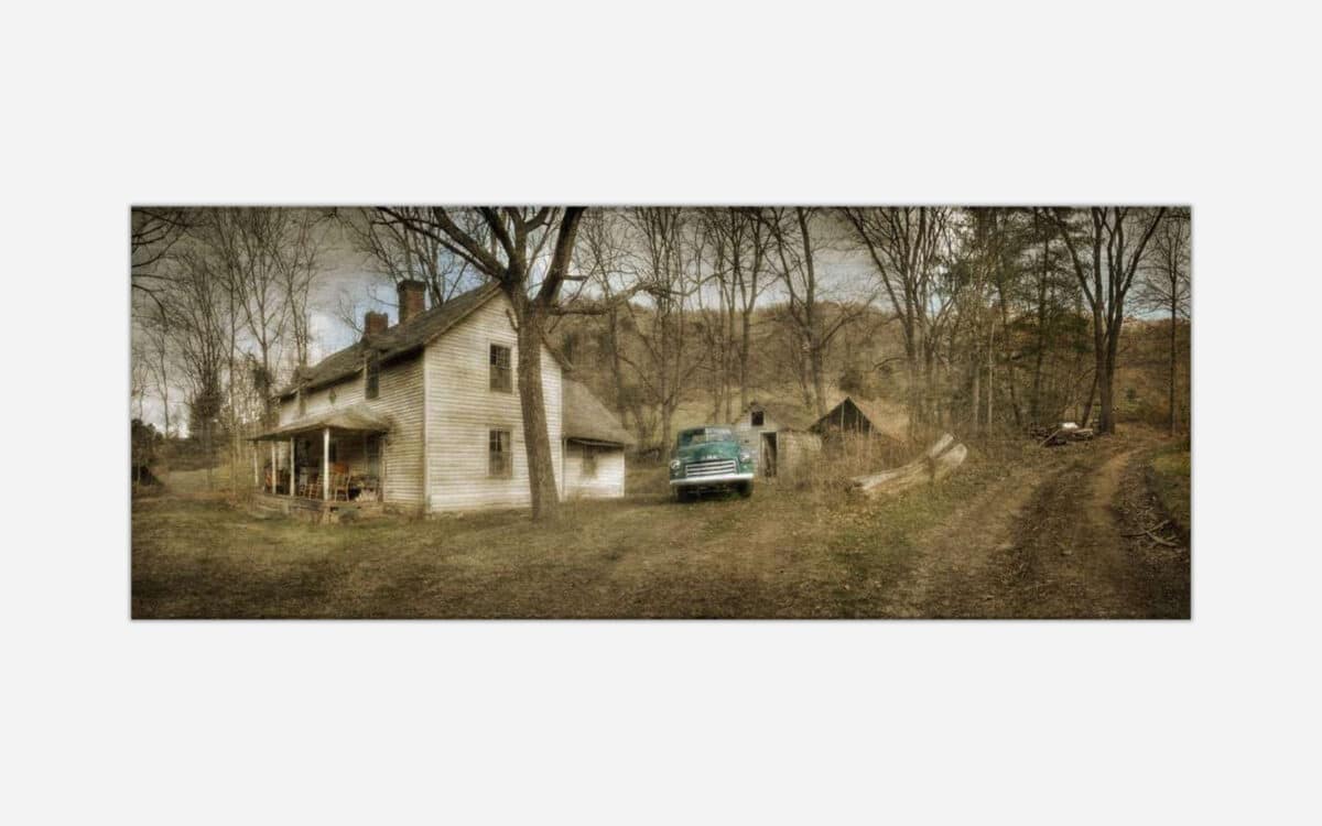 A rustic image of an old abandoned house with a vintage green truck parked outside, surrounded by a barren countryside landscape.